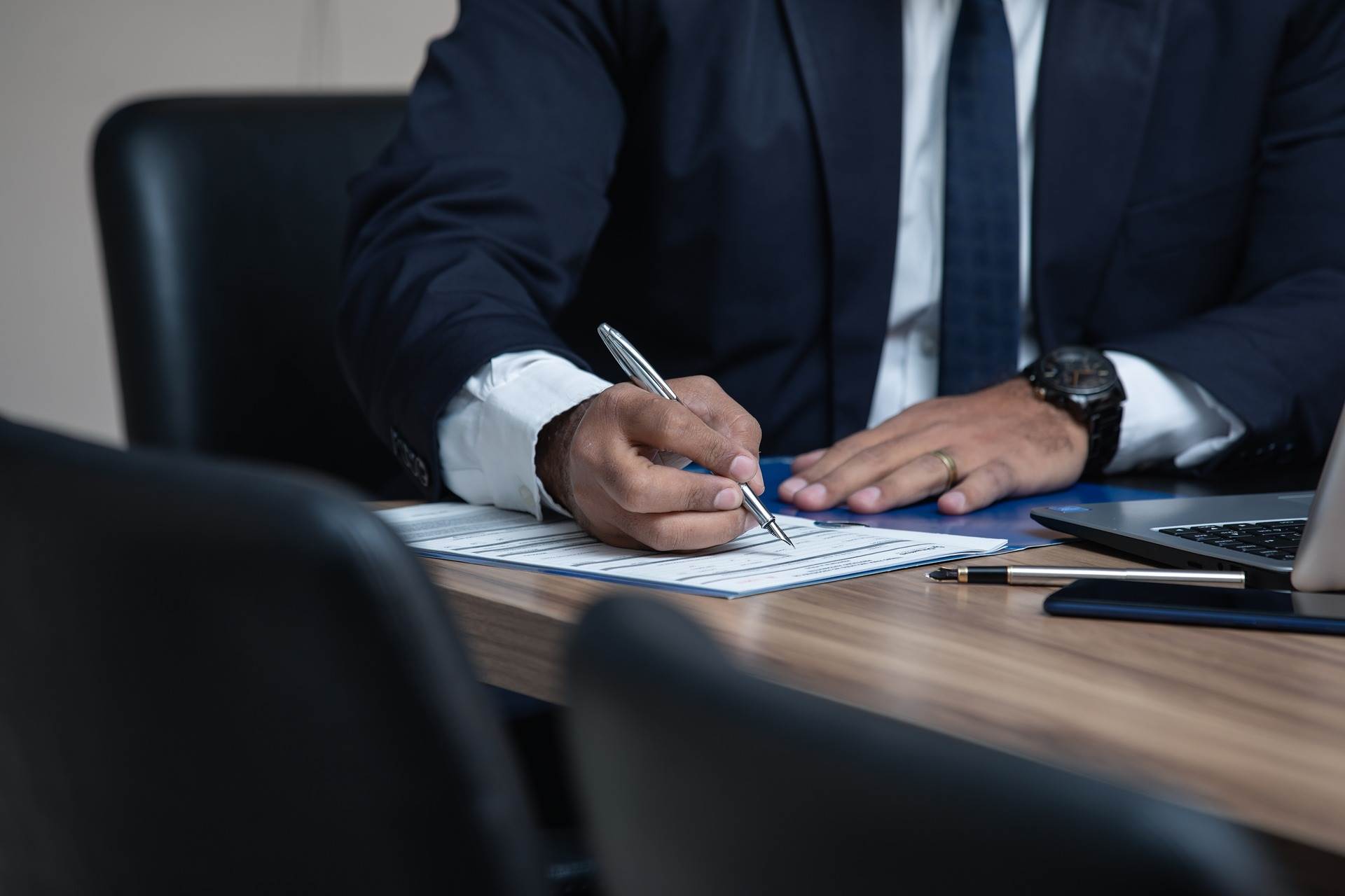 Lawyer Writing on Notepad